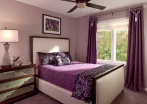 Elegant bedroom design in purple color theme